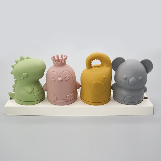 Juguetes de baño de silicona con forma de pingüino, dinosaurio, koala y botella.