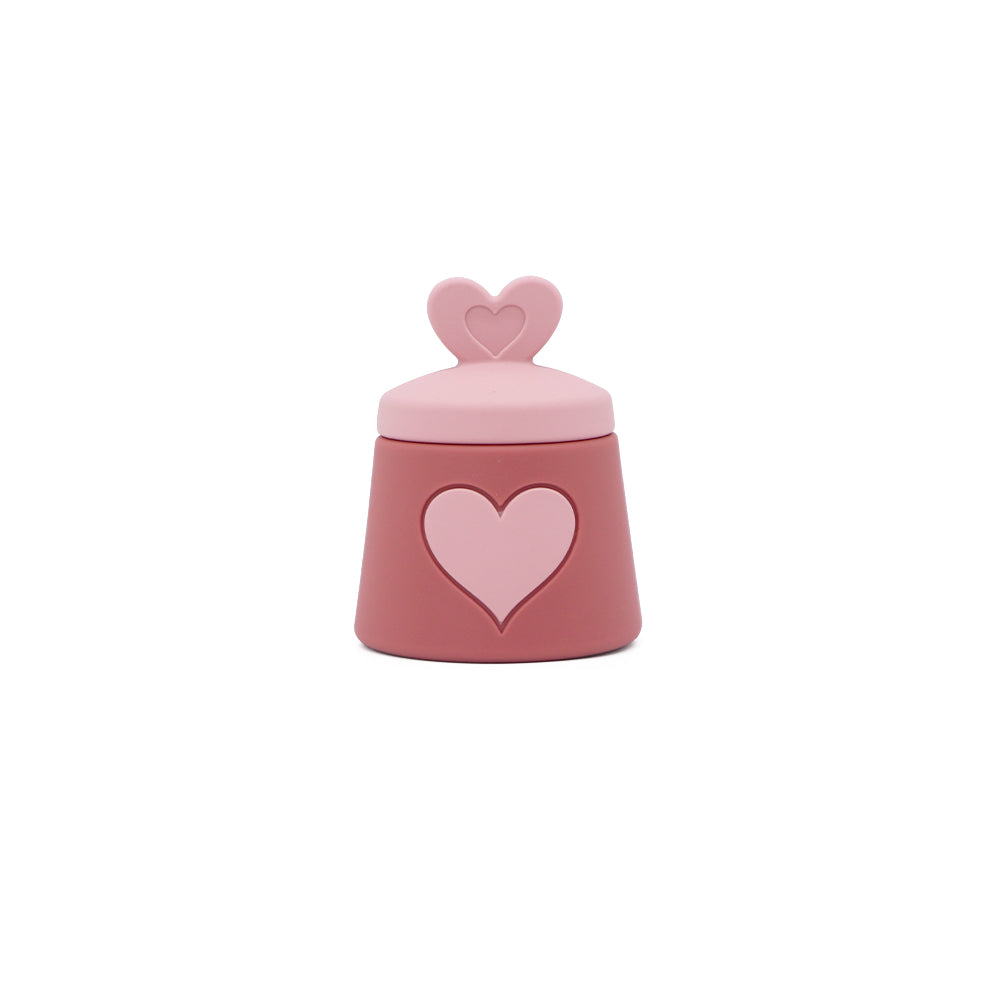 Azucarero de silicona rosa con tapa de corazón.