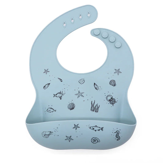 Babero de silicona con bolsillo recogedor y diseño marino, color azul empolvado